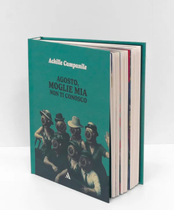 The finished book standing on white: a teal cover with figures in diving helmets