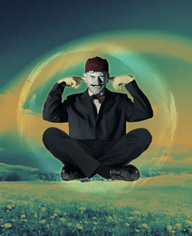 A man levitating cross-legged above a green meadow
