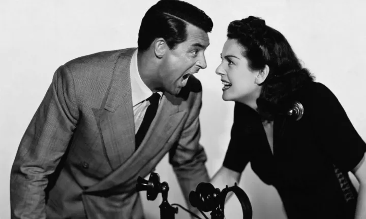 A screwball comedy still: a man and a woman shouting at each other