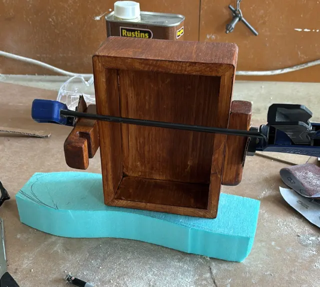 The dock frame glued and clamped, walnut stain drying
