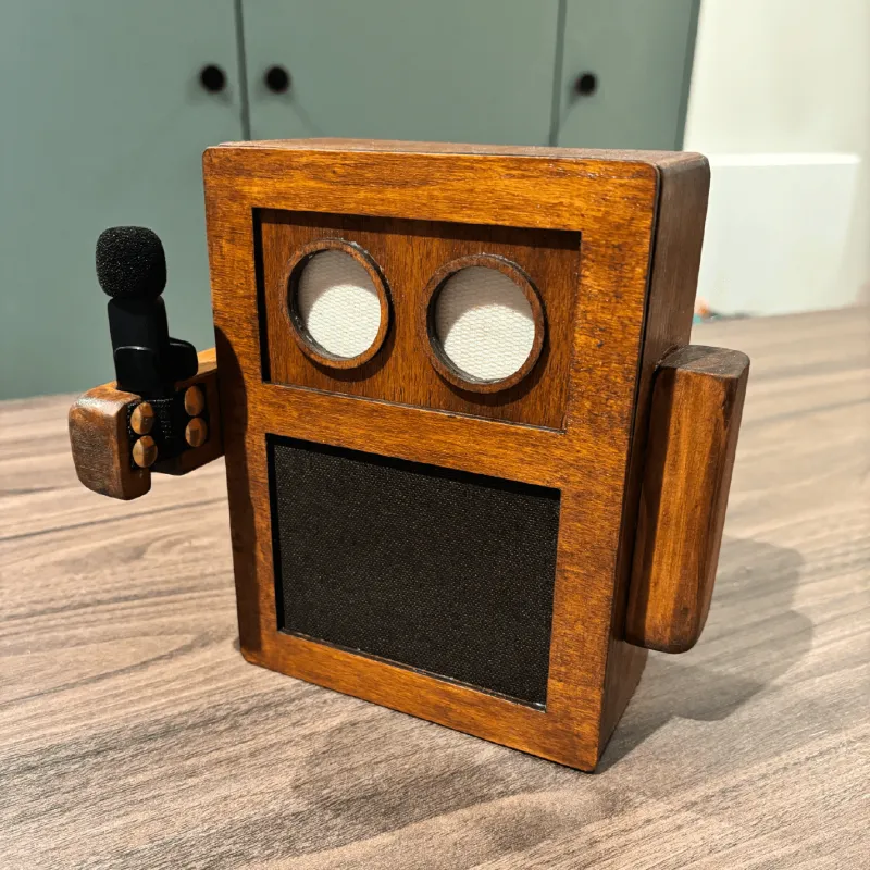 The finished Lugh dock on a wooden table, microphone clipped to its side