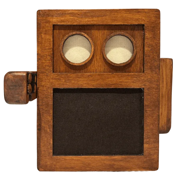 The Lugh dock: walnut-stained wood, two round eyes, a clip microphone on the side