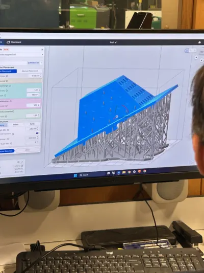 Slicer software preparing the printed parts, seen over a shoulder