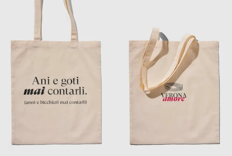Two tote bags: “Ani e goti mai contati” and the Verona Amore mark