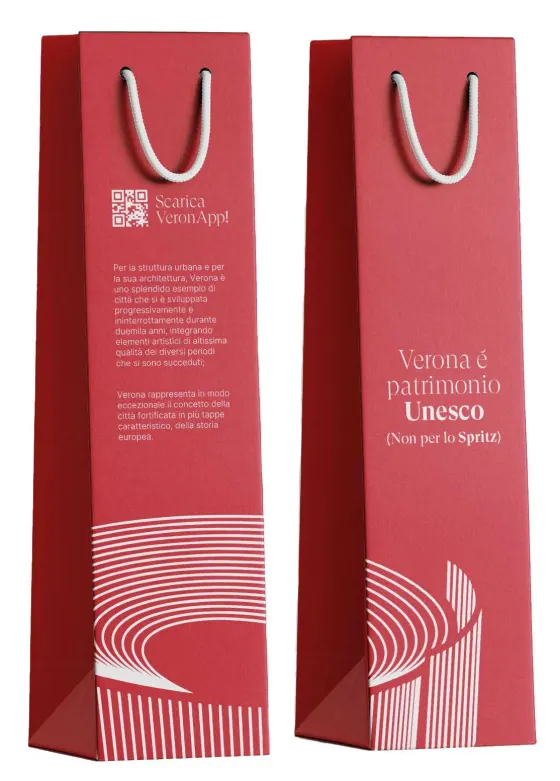Two crimson wine bags printed with the Arena lines