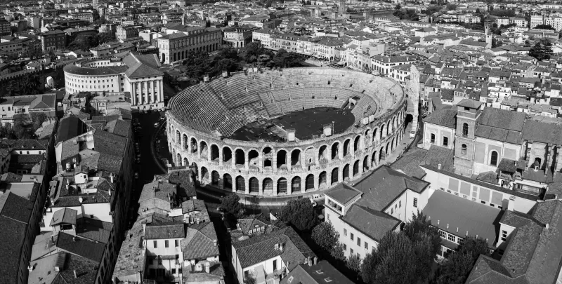 Aerial view of the Arena among Verona's rooftops, in black and white