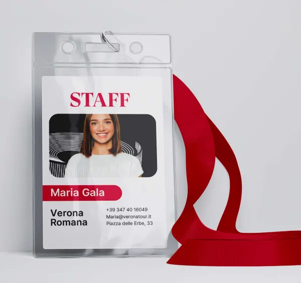 A staff badge on a red lanyard